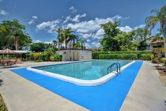 community pool with a patio