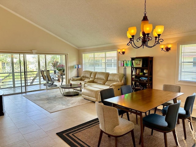 dining room featuring a textured ceiling, a notable chandelier, ornamental molding, and vaulted ceiling