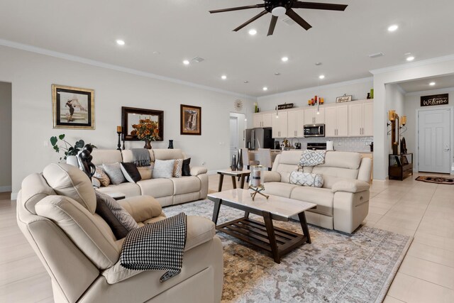 living area with light tile patterned flooring, ornamental molding, recessed lighting, and a ceiling fan
