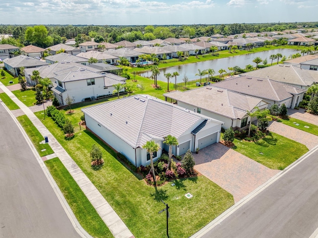bird's eye view with a residential view and a water view