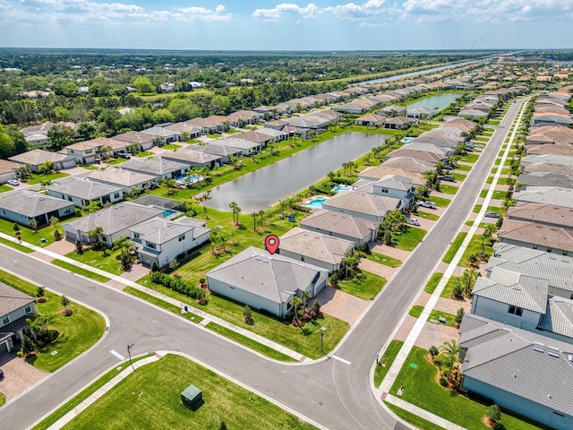 aerial view with a residential view and a water view