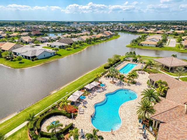 bird's eye view featuring a water view and a residential view