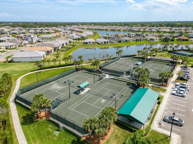 drone / aerial view featuring a water view and a residential view