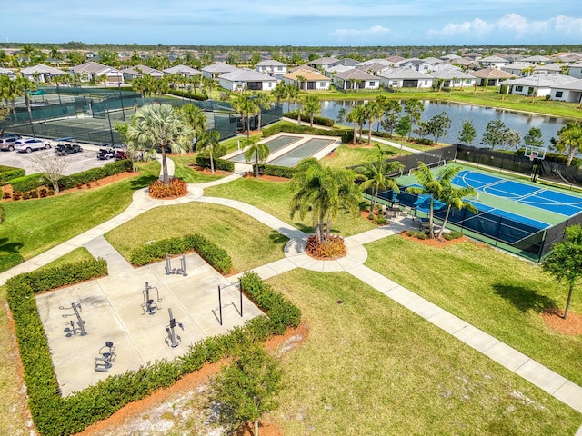 birds eye view of property with a residential view and a water view