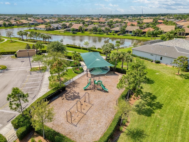 aerial view featuring a residential view and a water view