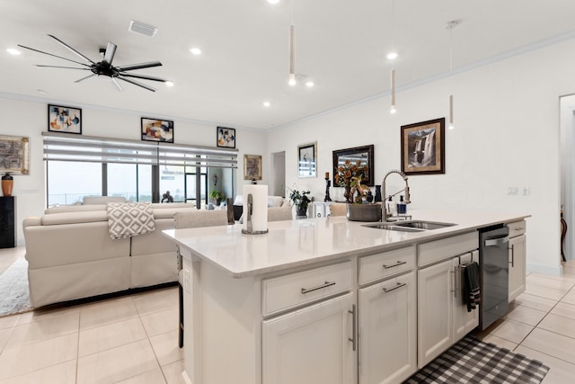 kitchen with a sink, stainless steel dishwasher, crown molding, and open floor plan