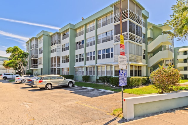 view of property with uncovered parking