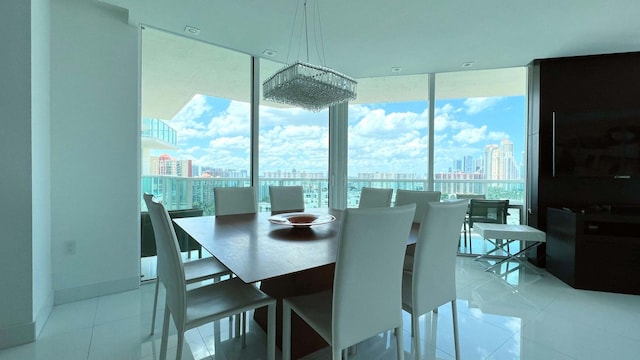 dining space with floor to ceiling windows, light tile patterned flooring, and baseboards