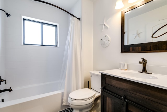 bathroom featuring shower / bath combination with curtain, toilet, and vanity