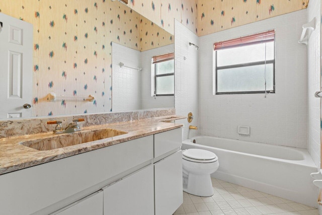 full bathroom with vanity, wallpapered walls, tile patterned flooring,  shower combination, and toilet