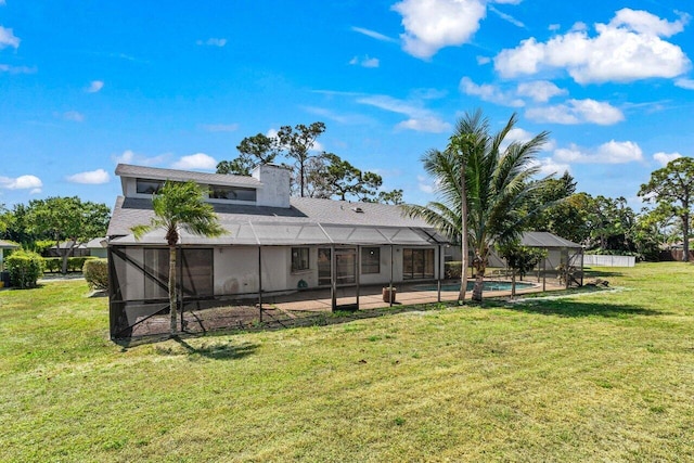 back of property featuring an outdoor pool, a lawn, a patio, a lanai, and a chimney