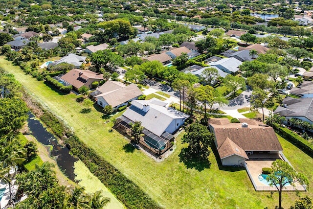 bird's eye view featuring a water view and a residential view