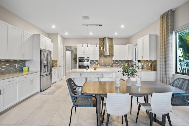 dining area featuring recessed lighting, visible vents, and light tile patterned flooring