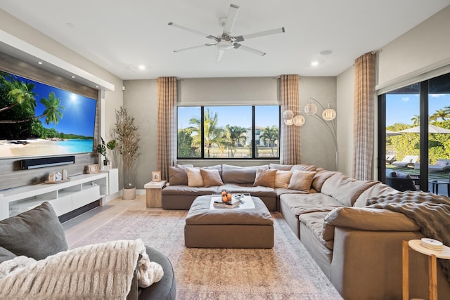 living room with ceiling fan and recessed lighting