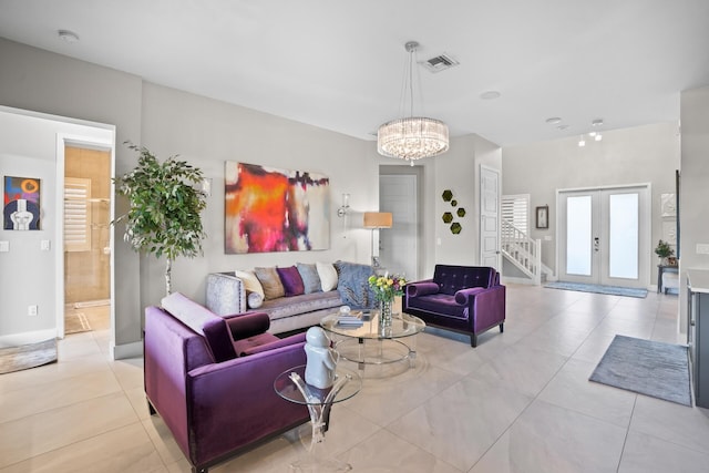 living area with an inviting chandelier, visible vents, stairs, light tile patterned flooring, and french doors