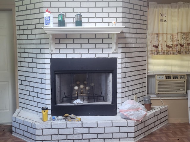 interior details with cooling unit and a brick fireplace