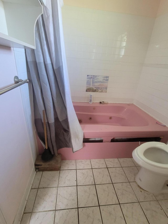 full bathroom featuring tile patterned flooring and toilet