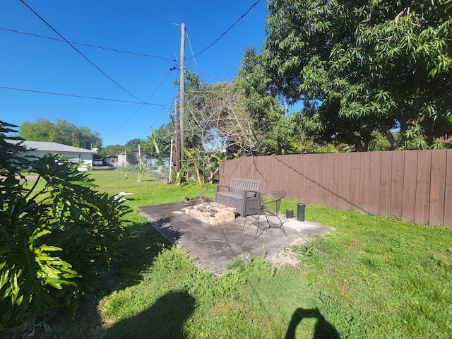 view of yard with a patio area and a fenced backyard