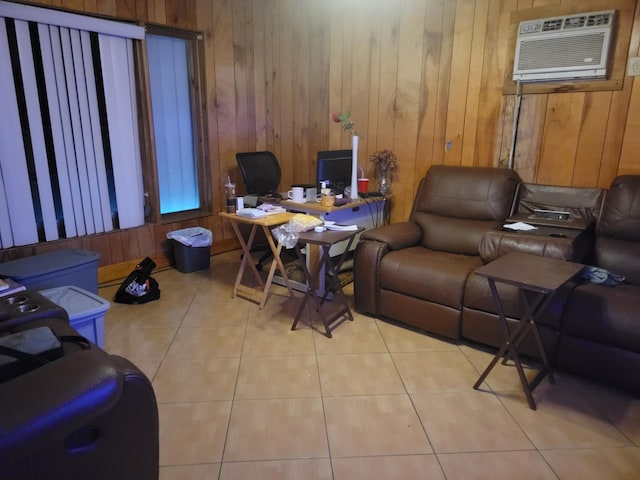 office area with light tile patterned floors, wooden walls, and an AC wall unit