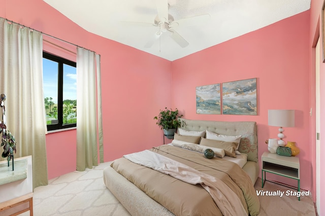 6941 SE Constitution Blvd Unit 101, Hobe Sound, FL 33455 - bedroom featuring carpet floors and a ceiling fan