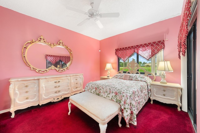 carpeted bedroom featuring a textured ceiling and ceiling fan