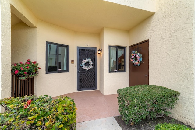 6941 SE Constitution Blvd Unit 101, Hobe Sound, FL 33455 - entrance to property with stucco siding