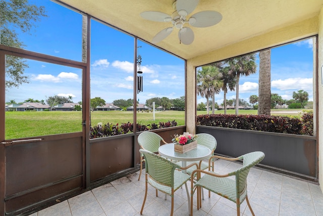 6941 SE Constitution Blvd Unit 101, Hobe Sound, FL 33455 - sunroom / solarium featuring a ceiling fan and vaulted ceiling