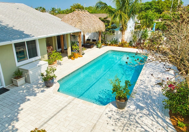 view of swimming pool with fence, a patio area, and a fenced in pool