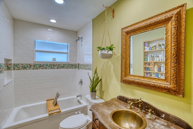 bathroom featuring recessed lighting, bathing tub / shower combination, vanity, and toilet