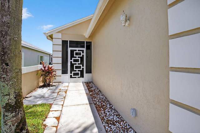 7848 Mansfield Hollow Rd, Delray Beach, FL 33446 - property entrance featuring stucco siding