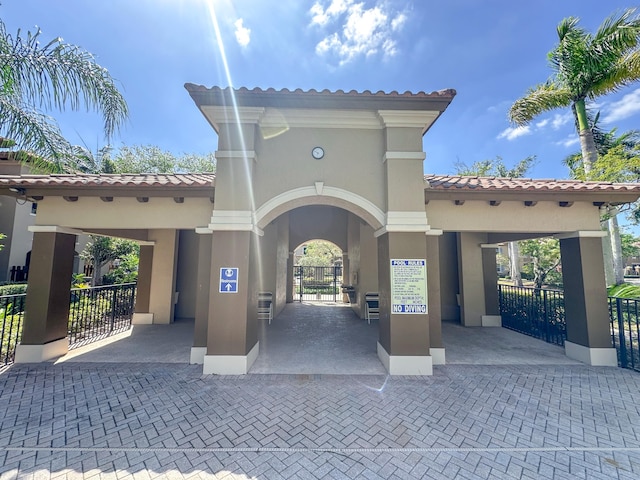 view of community with fence and a gate