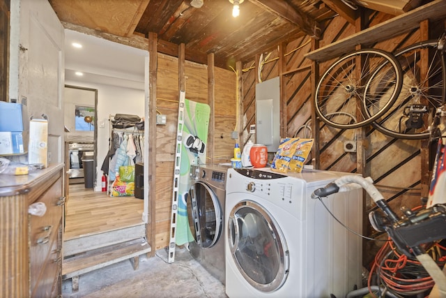 laundry area featuring electric panel and washing machine and dryer