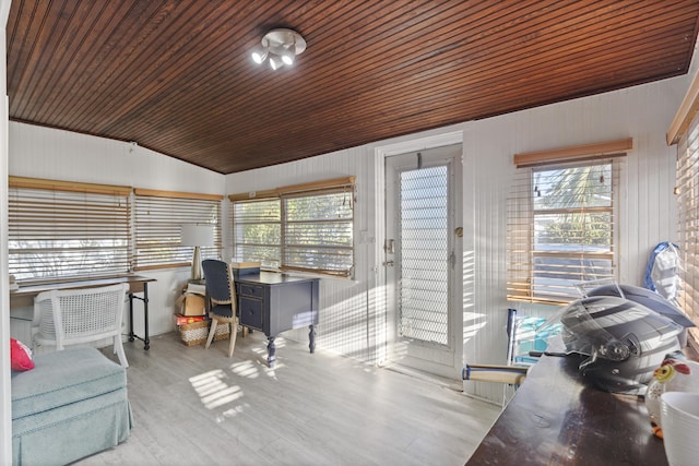 sunroom / solarium featuring lofted ceiling