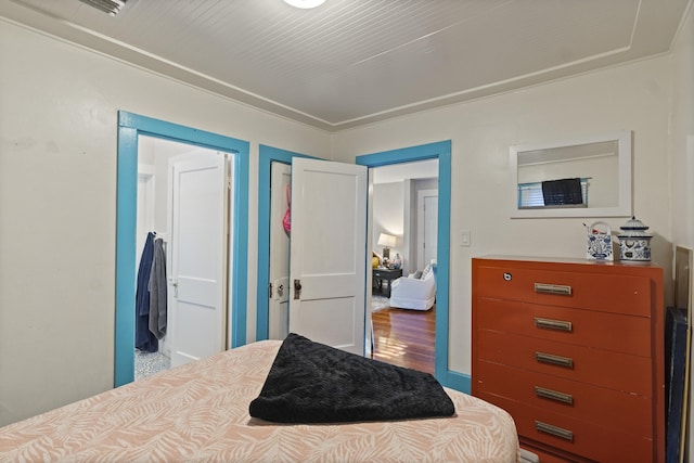 bedroom with wood finished floors