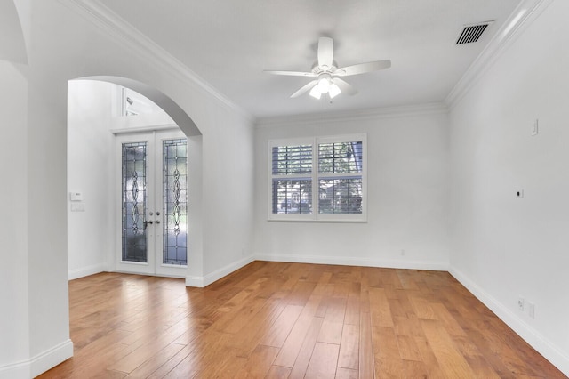 138 Victorian Ln, Jupiter, FL 33458 - spare room with french doors, a ceiling fan, visible vents, arched walkways, and hardwood / wood-style flooring