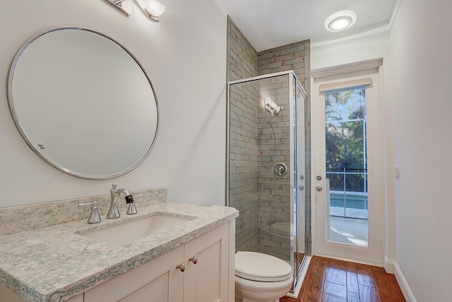 138 Victorian Ln, Jupiter, FL 33458 - bathroom with vanity, toilet, baseboards, a shower stall, and wood finished floors