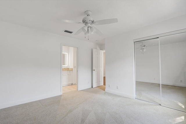 138 Victorian Ln, Jupiter, FL 33458 - unfurnished bedroom with baseboards, light carpet, a closet, and visible vents