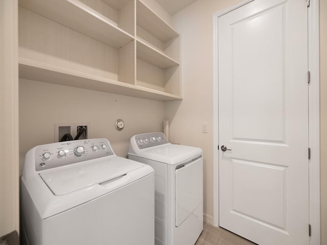 laundry room featuring laundry area and separate washer and dryer