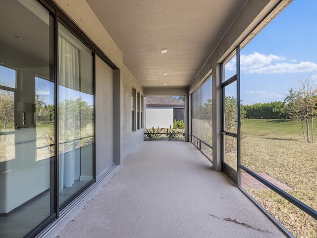 unfurnished sunroom featuring plenty of natural light