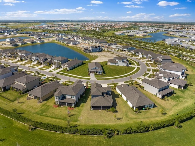 bird's eye view featuring a residential view and a water view