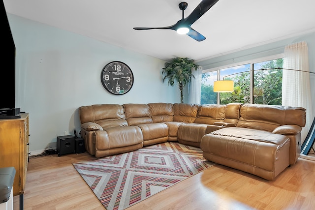 living room with light wood finished floors and ceiling fan