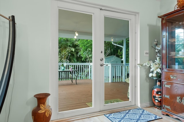 doorway to outside featuring french doors and wood finished floors