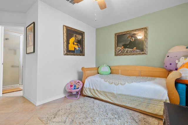 tiled bedroom featuring baseboards and ceiling fan