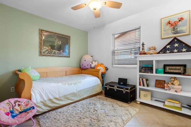 bedroom with tile patterned flooring and a ceiling fan