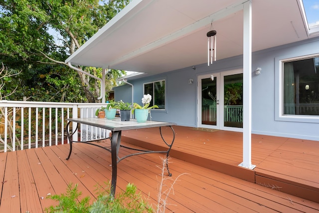 wooden deck featuring french doors