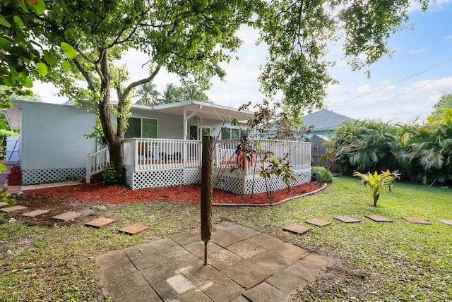 view of yard with covered porch