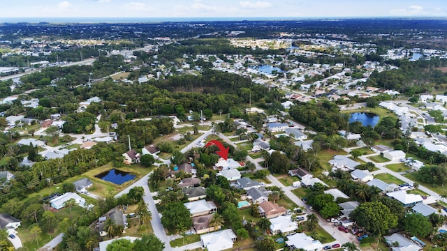 bird's eye view with a residential view and a water view