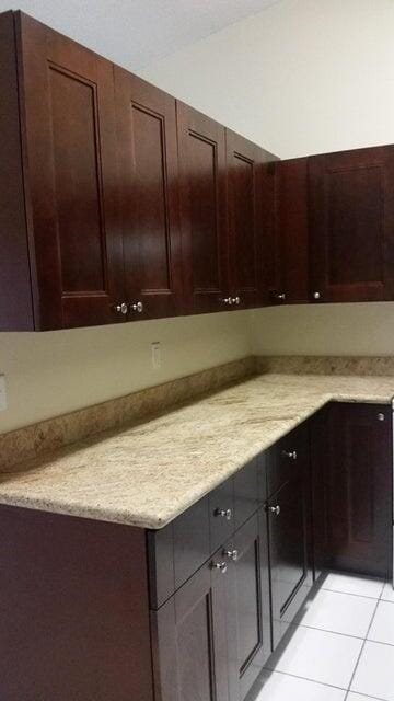 kitchen featuring light countertops and light tile patterned flooring