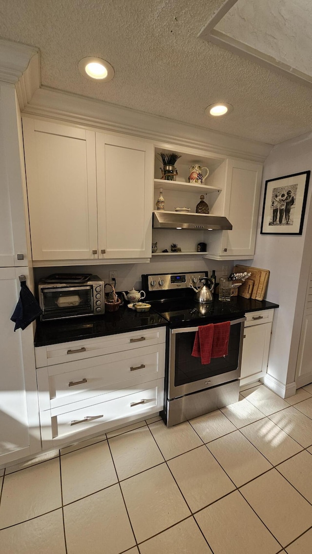 kitchen featuring white cabinetry, a textured ceiling, and stainless steel range with electric cooktop