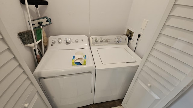 washroom with laundry area and separate washer and dryer